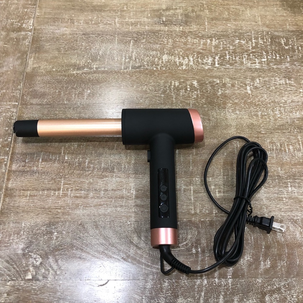 Hair curling wand with air cooling shot.
